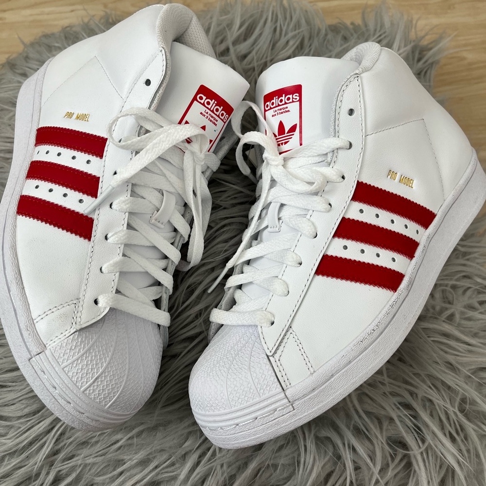 Brand new Hi Top Red& White Shell Toe Adidas Sneakers.